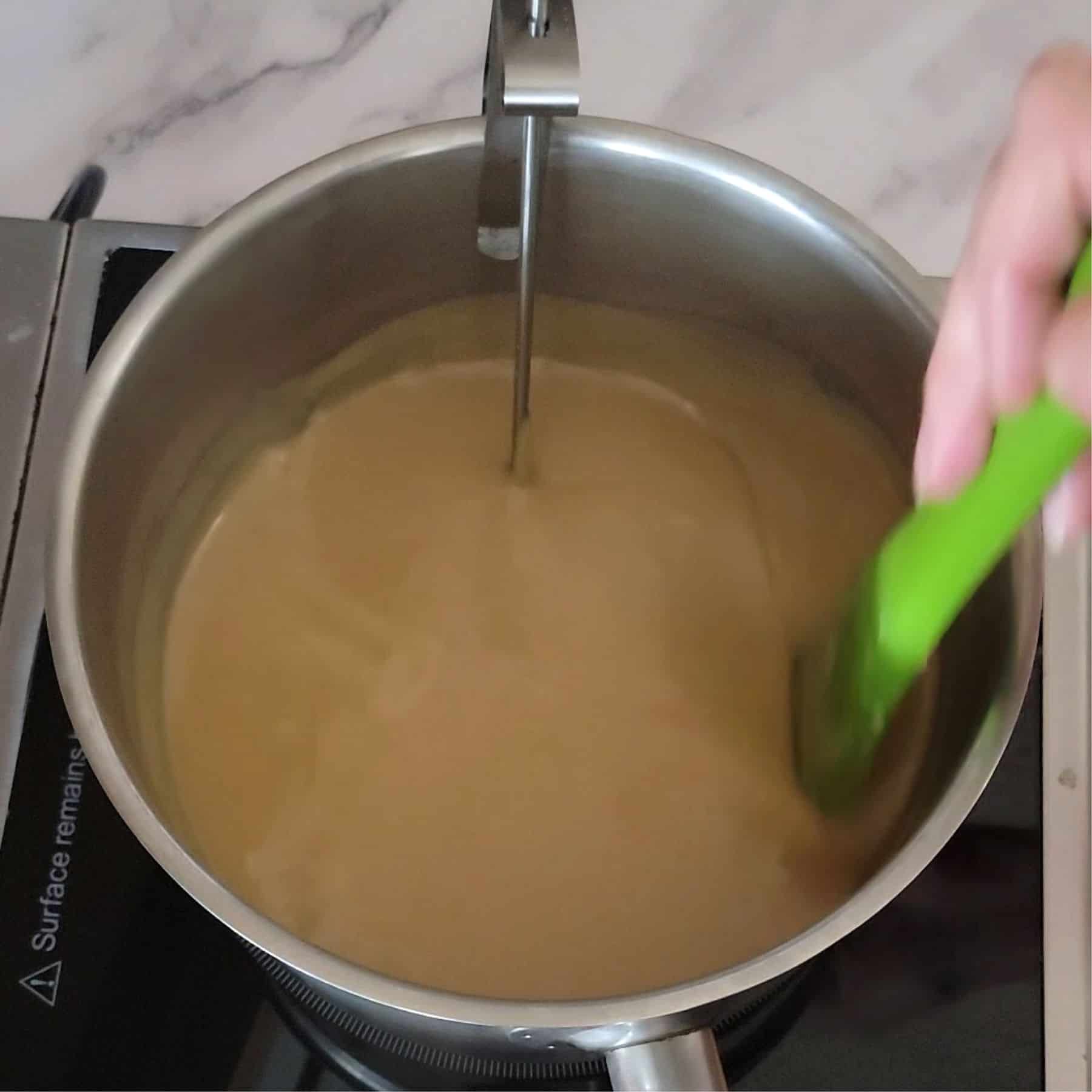 saucepan with boiling caramel