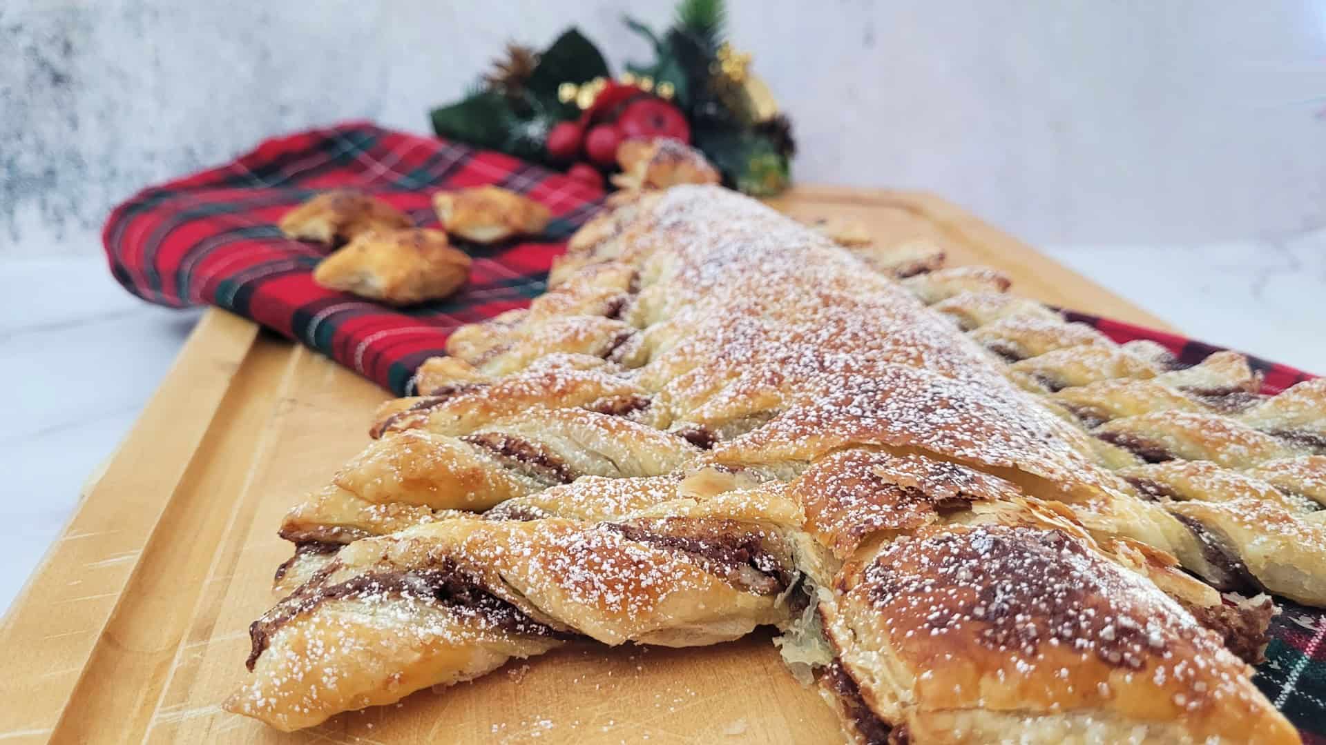 close up of the inside of puff pastry Christmas tree dessert sprinkled with powdered sugar