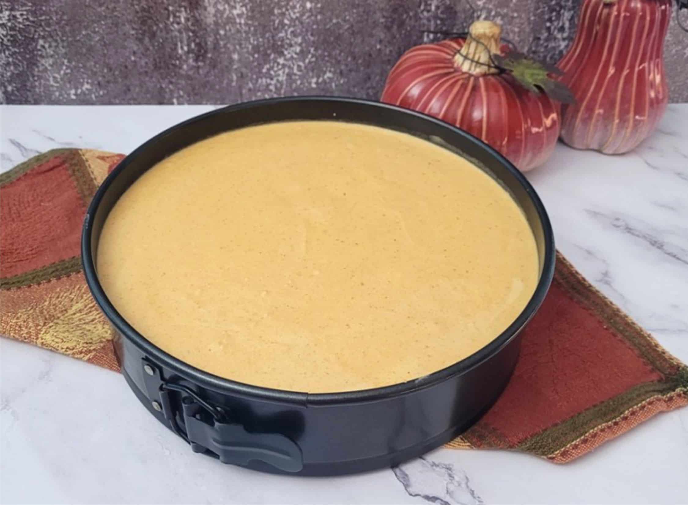 pumpkin mousse poured into springform pan before chilling