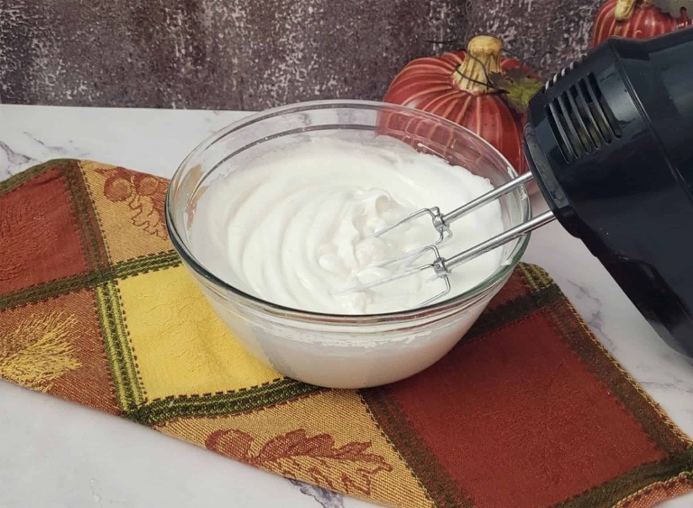 bowl of egg whites whipped to medium peaks