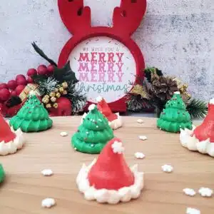 meringue cookies for Christmas including santa hats and christmas trees