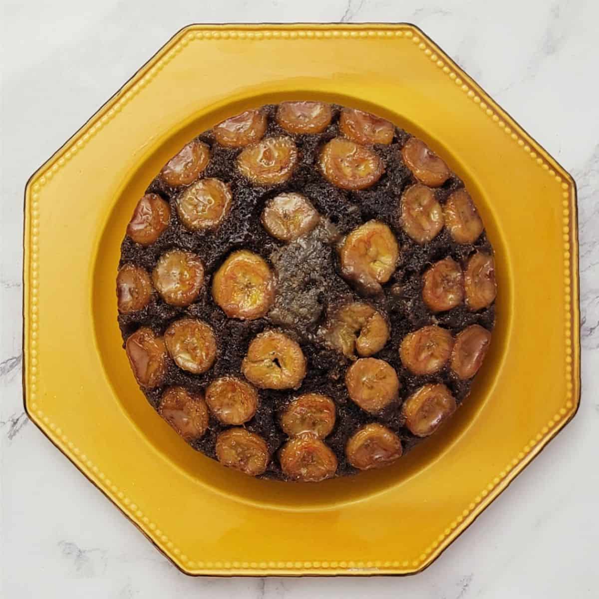 overhead view of an upside down banana chocolate cake