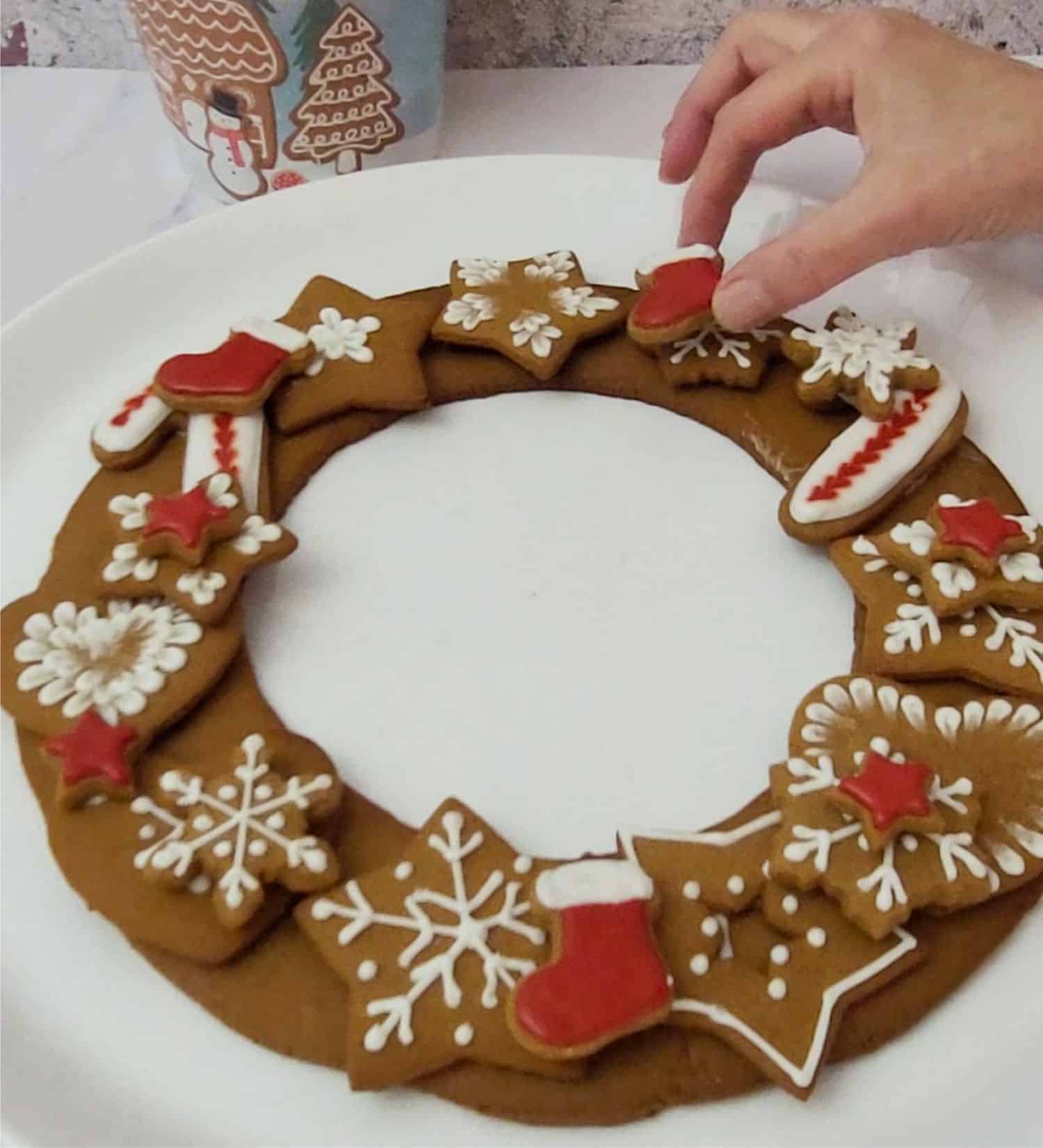 attaching Christmas cookies to cookie wreath base