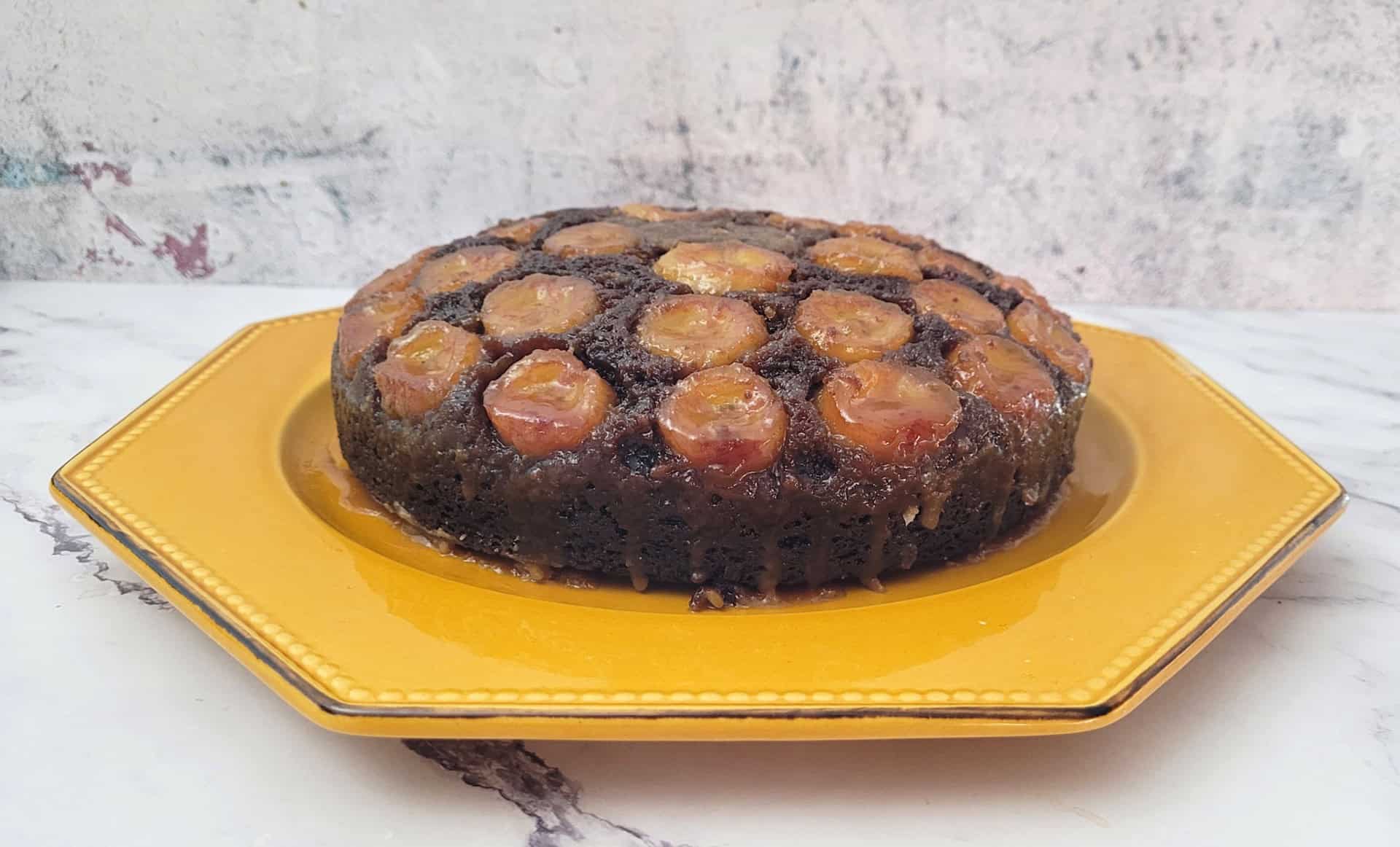 a banana chocolate upside down cake on a serving platter