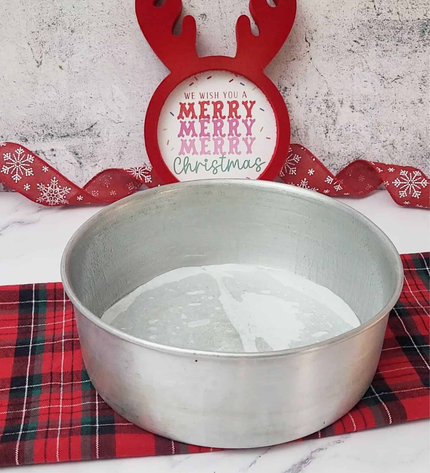 cake pan prepared with grease and parchment paper