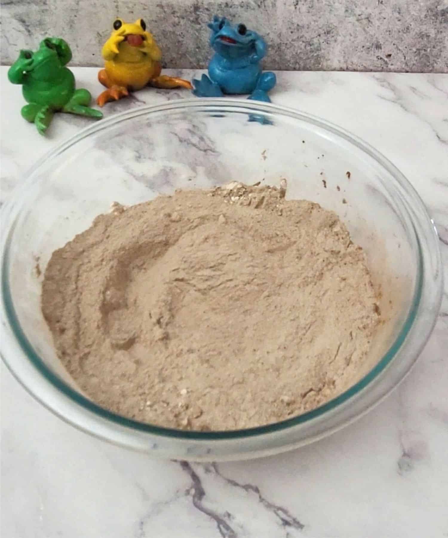 dry ingredients to make chocolate cake combined in a mixing bowl