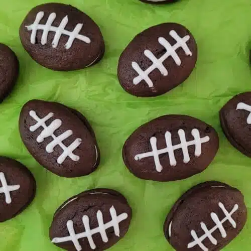 overhead view of football shaped whoopie pies made using boxed cake mix