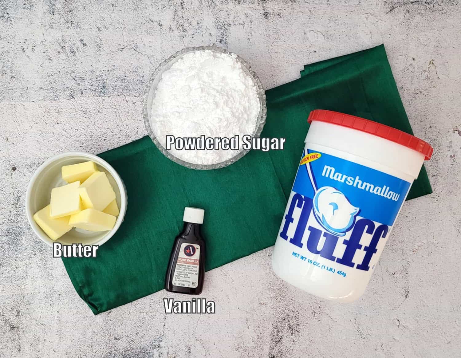 ingredients needed to make marshmallow filling including powdered sugar, butter, vanilla and marshmallow fluff