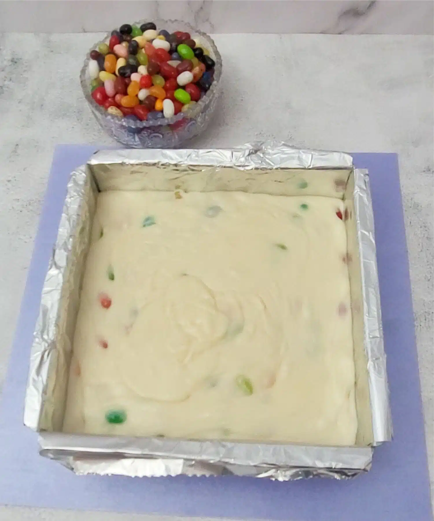 hot fudge poured into a square pan to set up