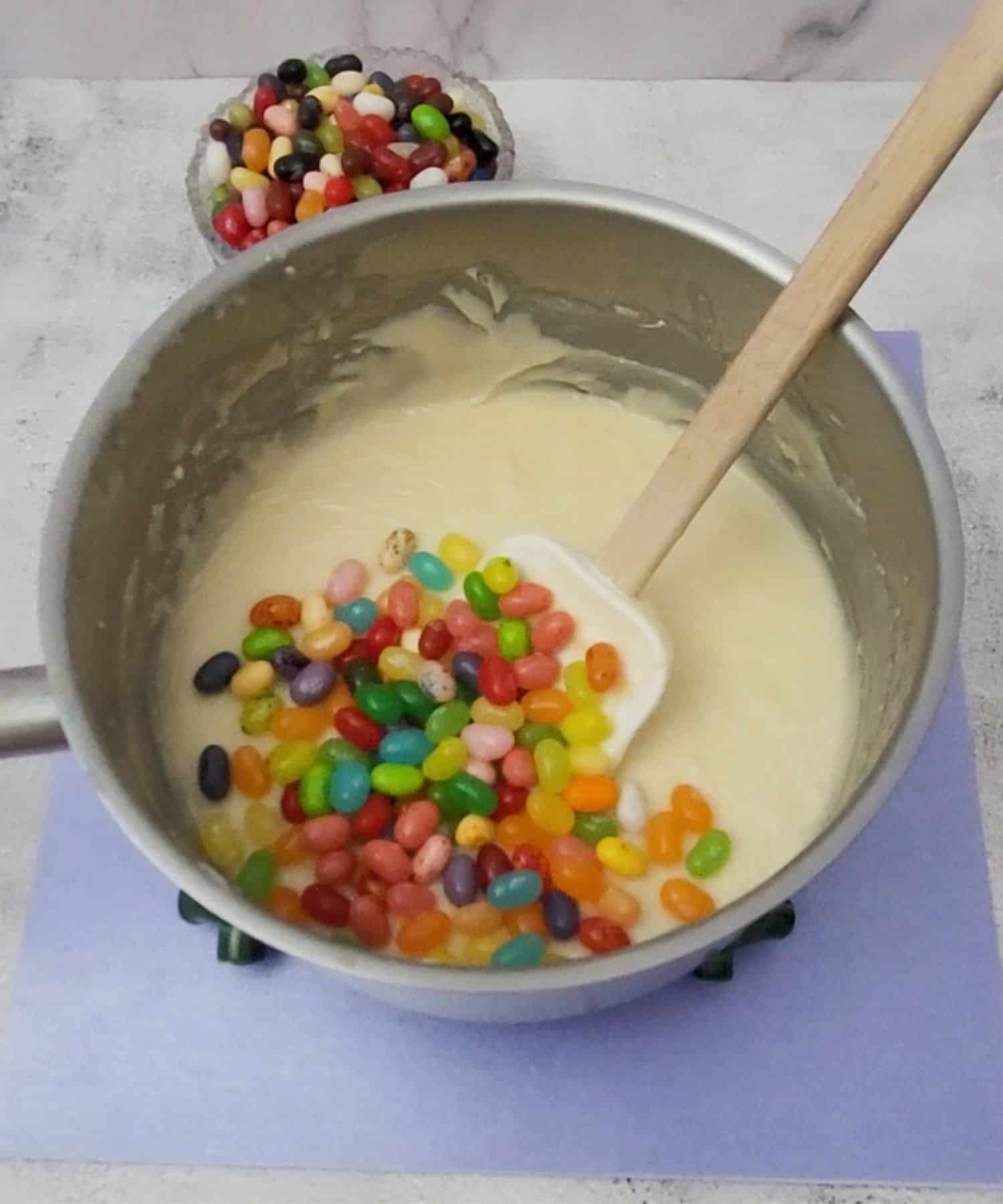 jelly beans added to saucepan with fudge