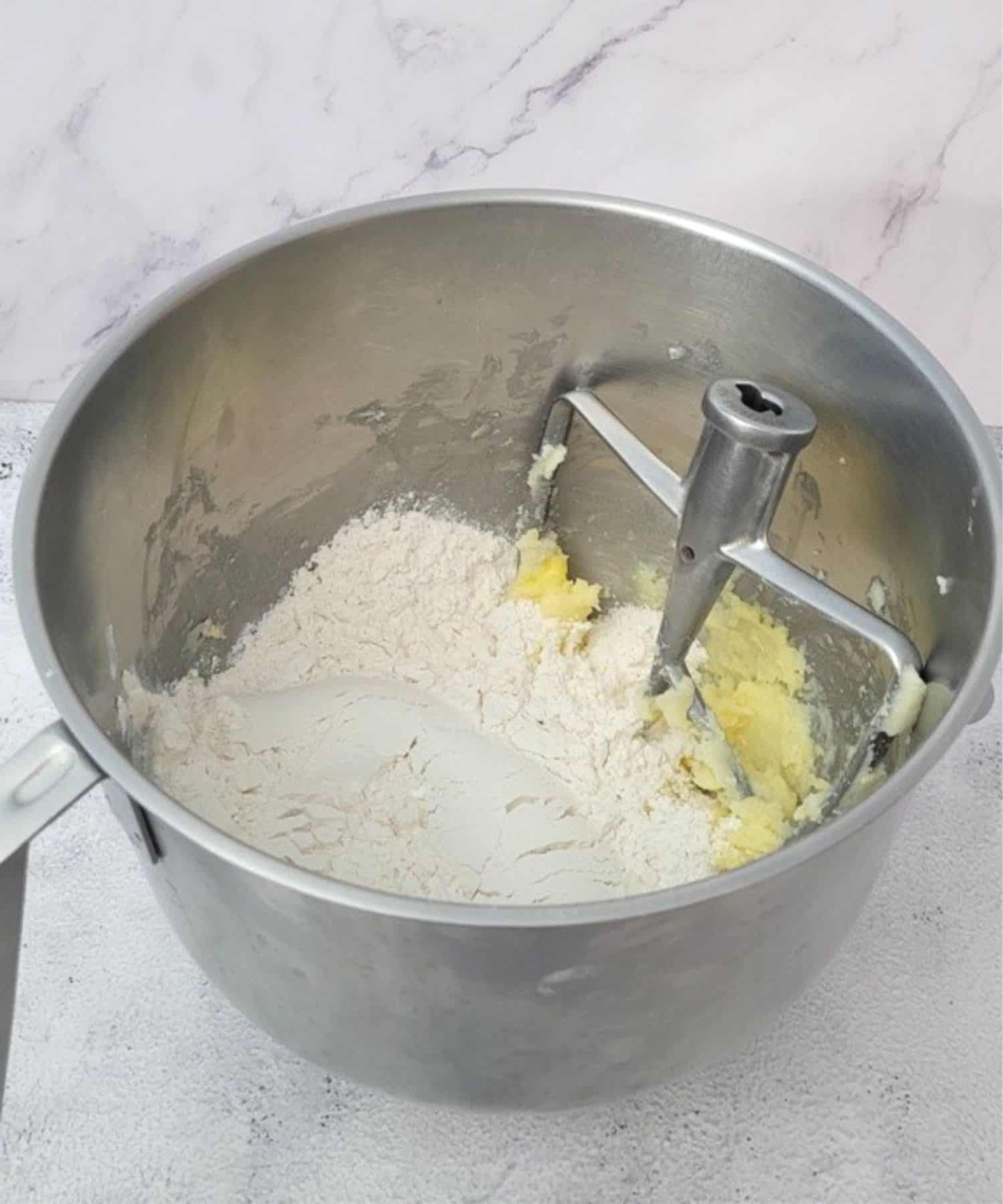 dry ingredients added to mixing bowl to make dough for Valentine's sandwich cookies recipe