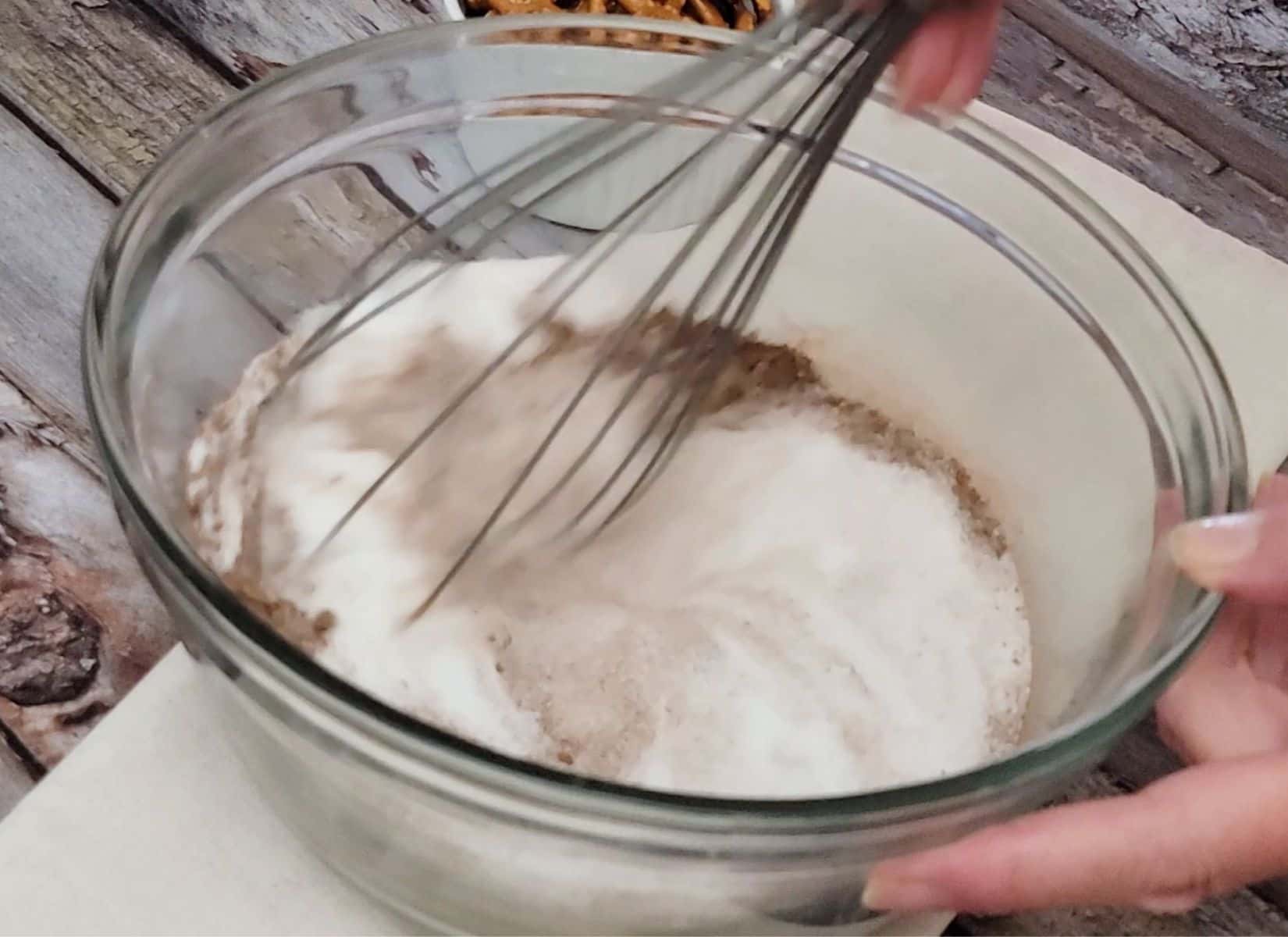 whisking together sugar, cocoa powder and salt in a mixing bowl