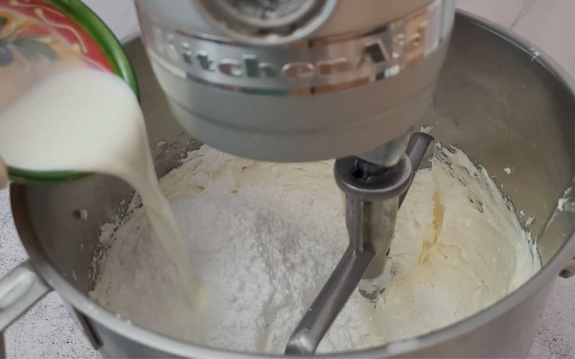 powdered sugar and milk added to mixing bowl to make buttercream