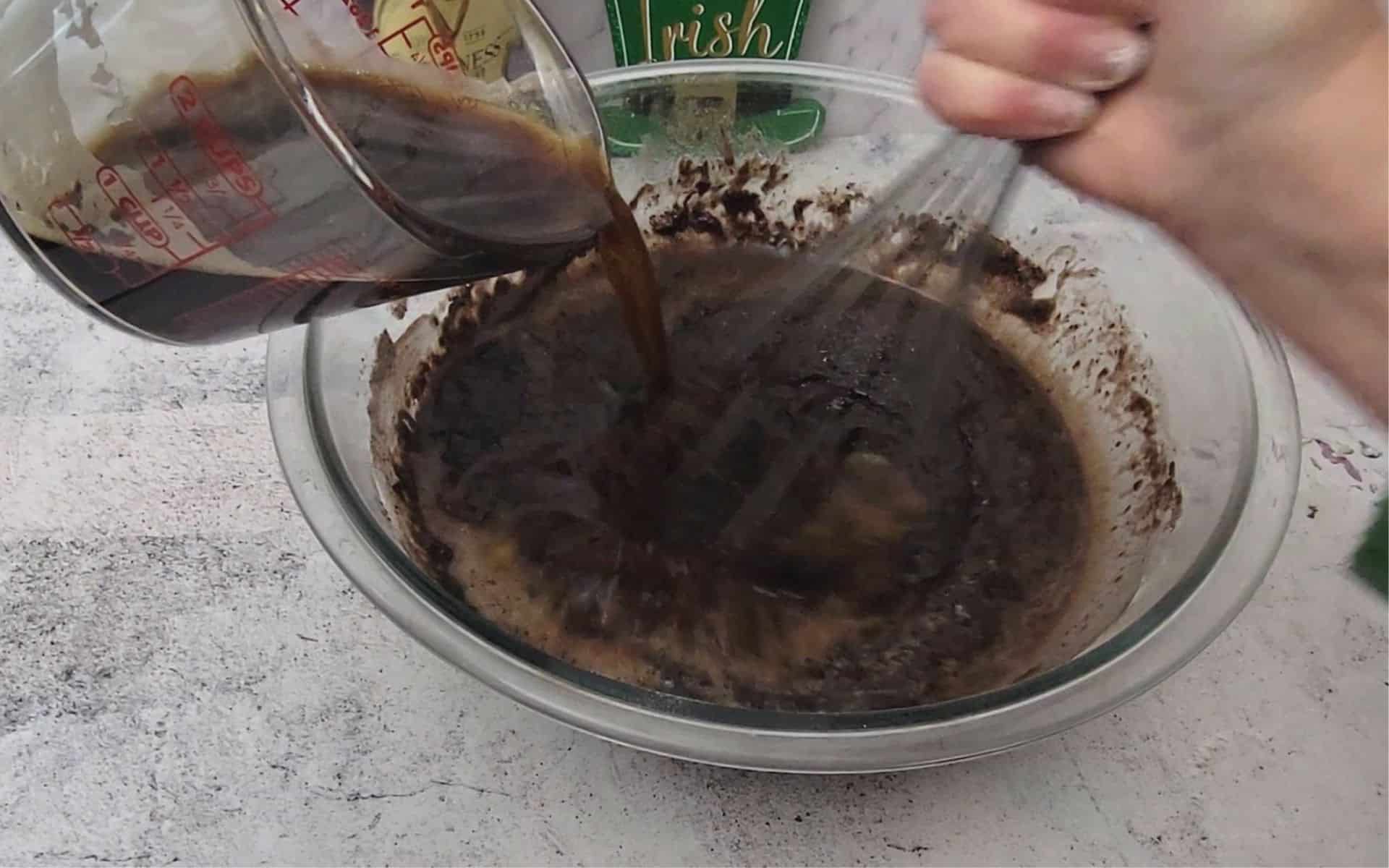 pouring Guinness stout into mixing bowl to make cake batter