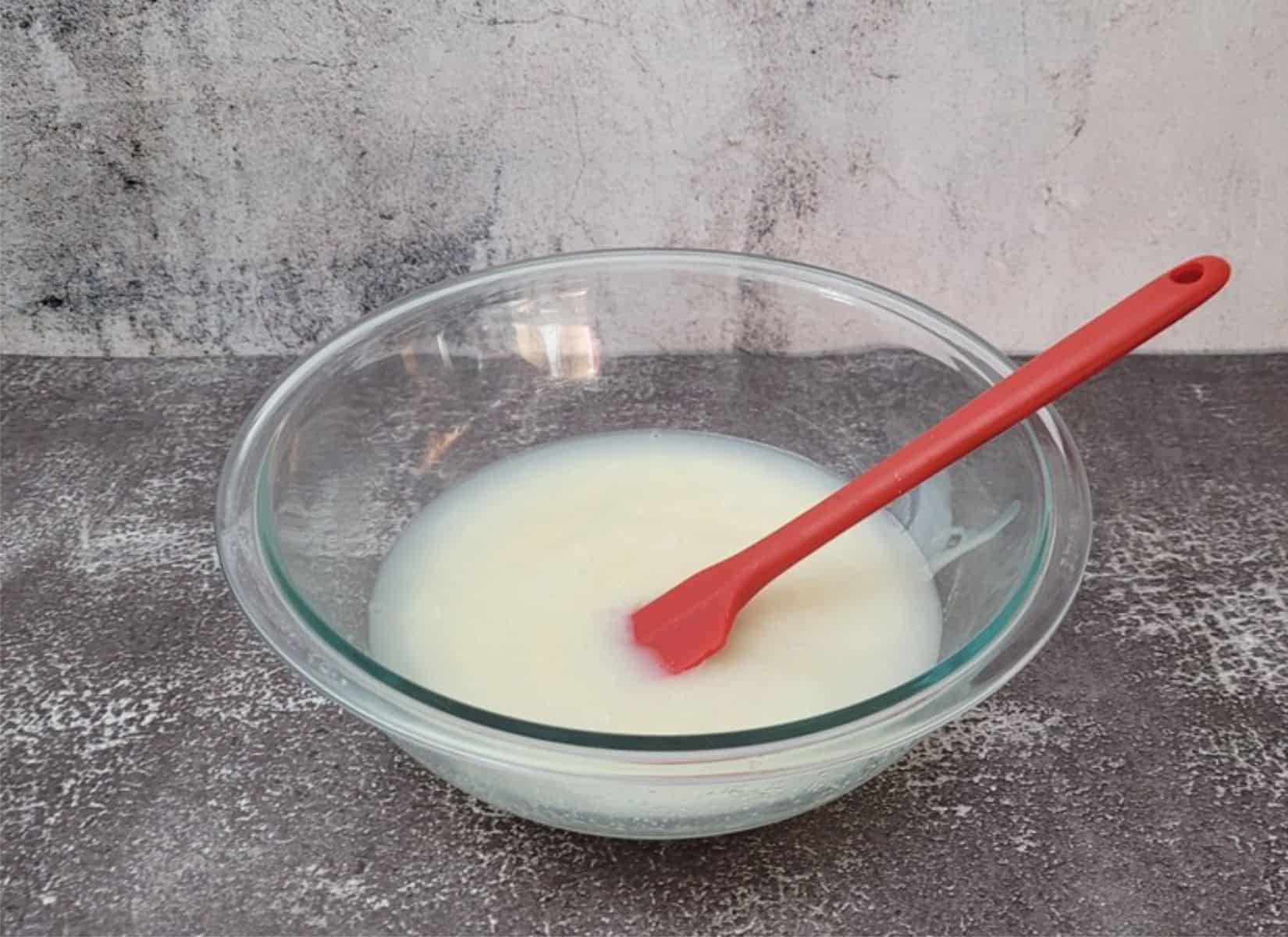 combine water, granulated sugar and sweetened condensed milk in a bowl and heat until sugar granules melt