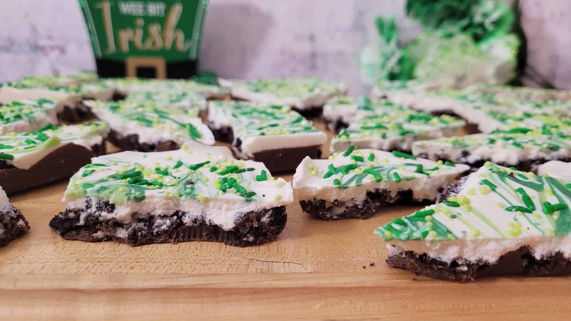 finished Oreo bark recipe broken into pieces and on a wooden serving board