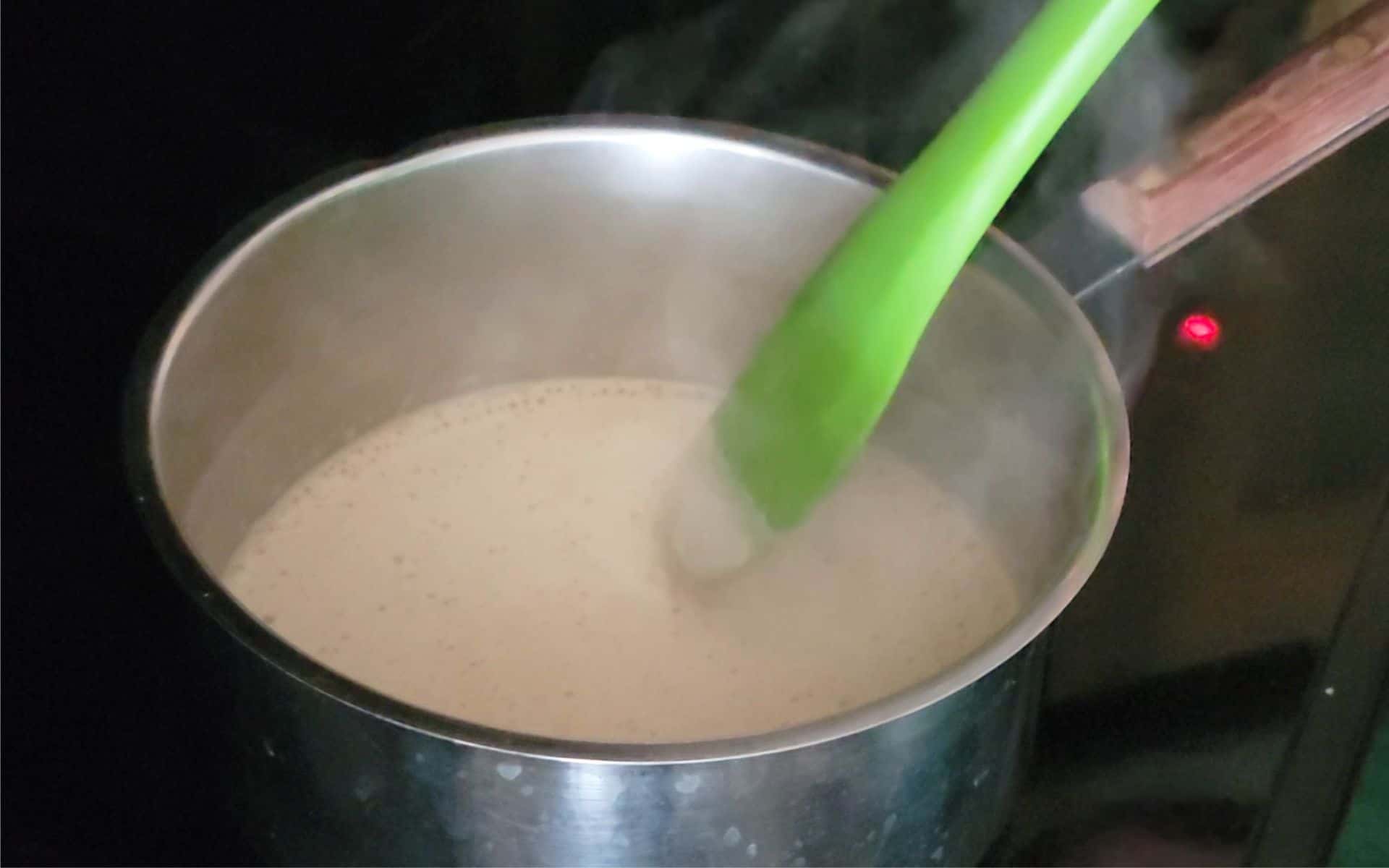 heating Guinness stout and granulated sugar in a saucepan to make simple syrup to moisten Guinness Chocolate Cake layers