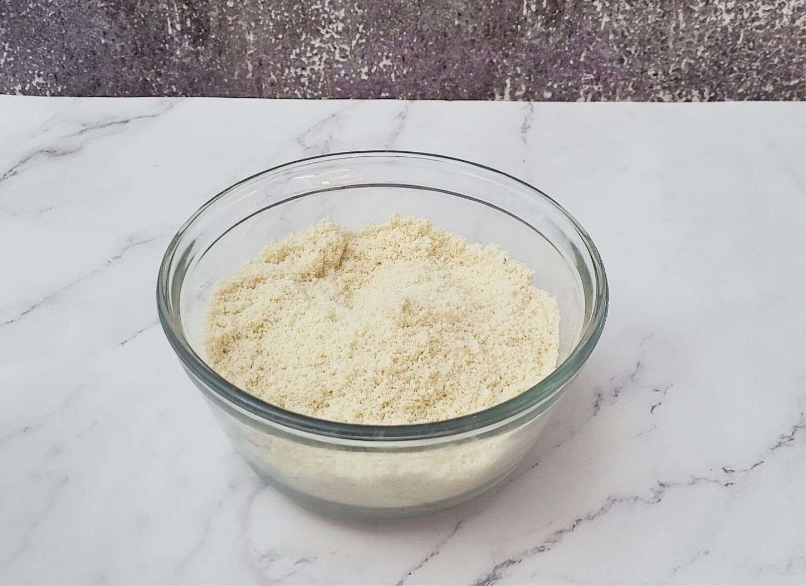 almond flour and baking powder and salt combined in a glass bowl