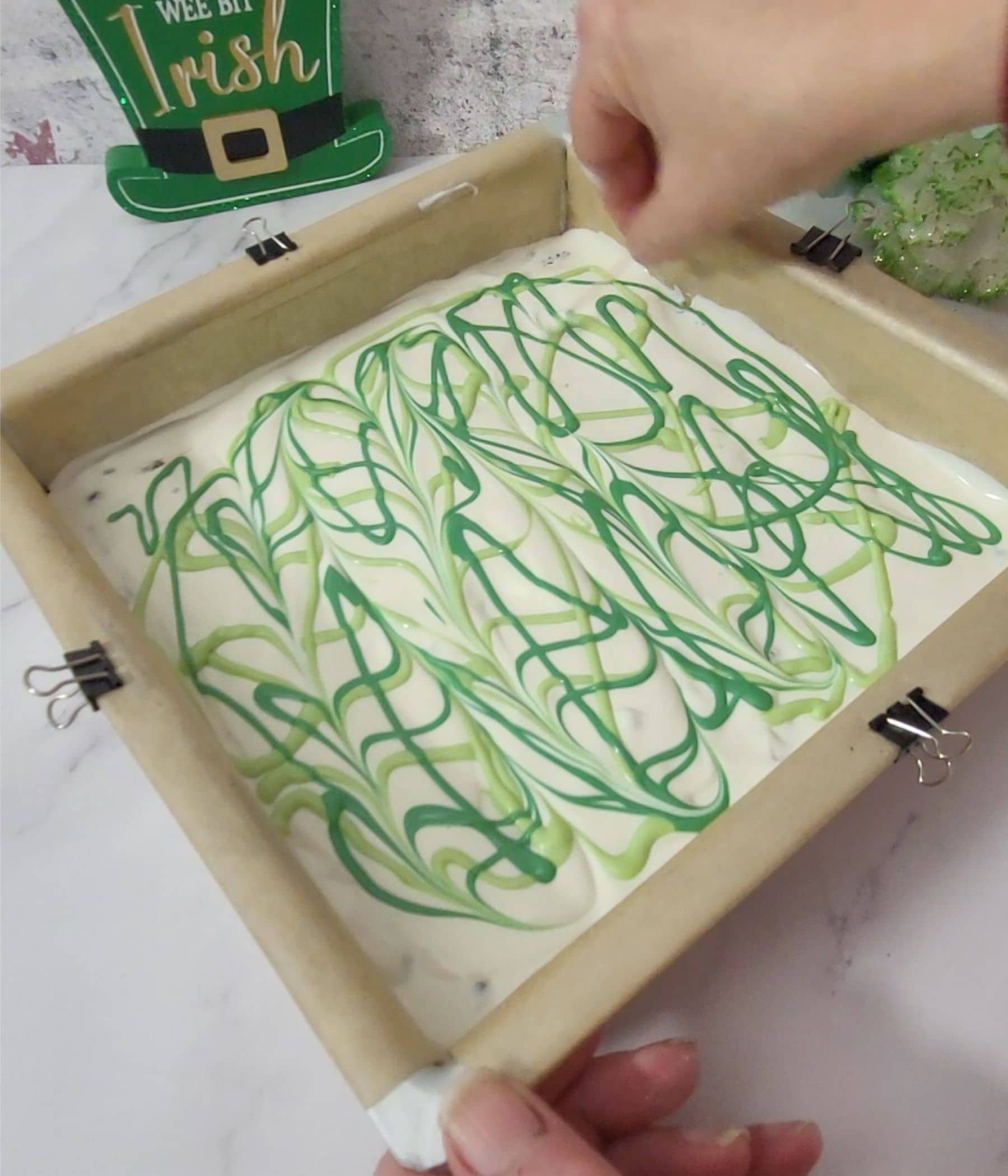 using a toothpick to create swirls in candy melts