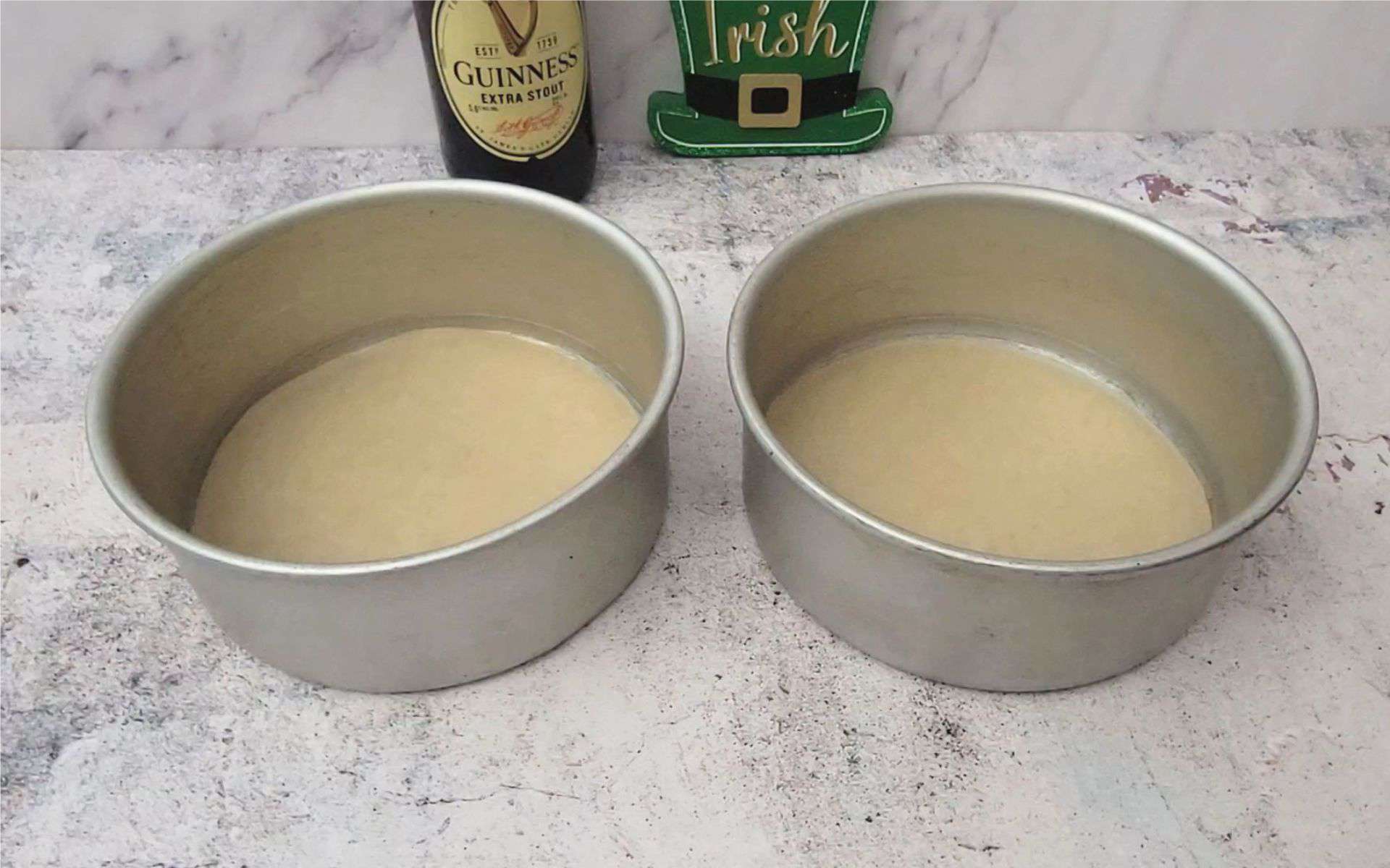 prepare two round cake pans with parchment paper to make chocolate Guinness cake for St Patrick's day