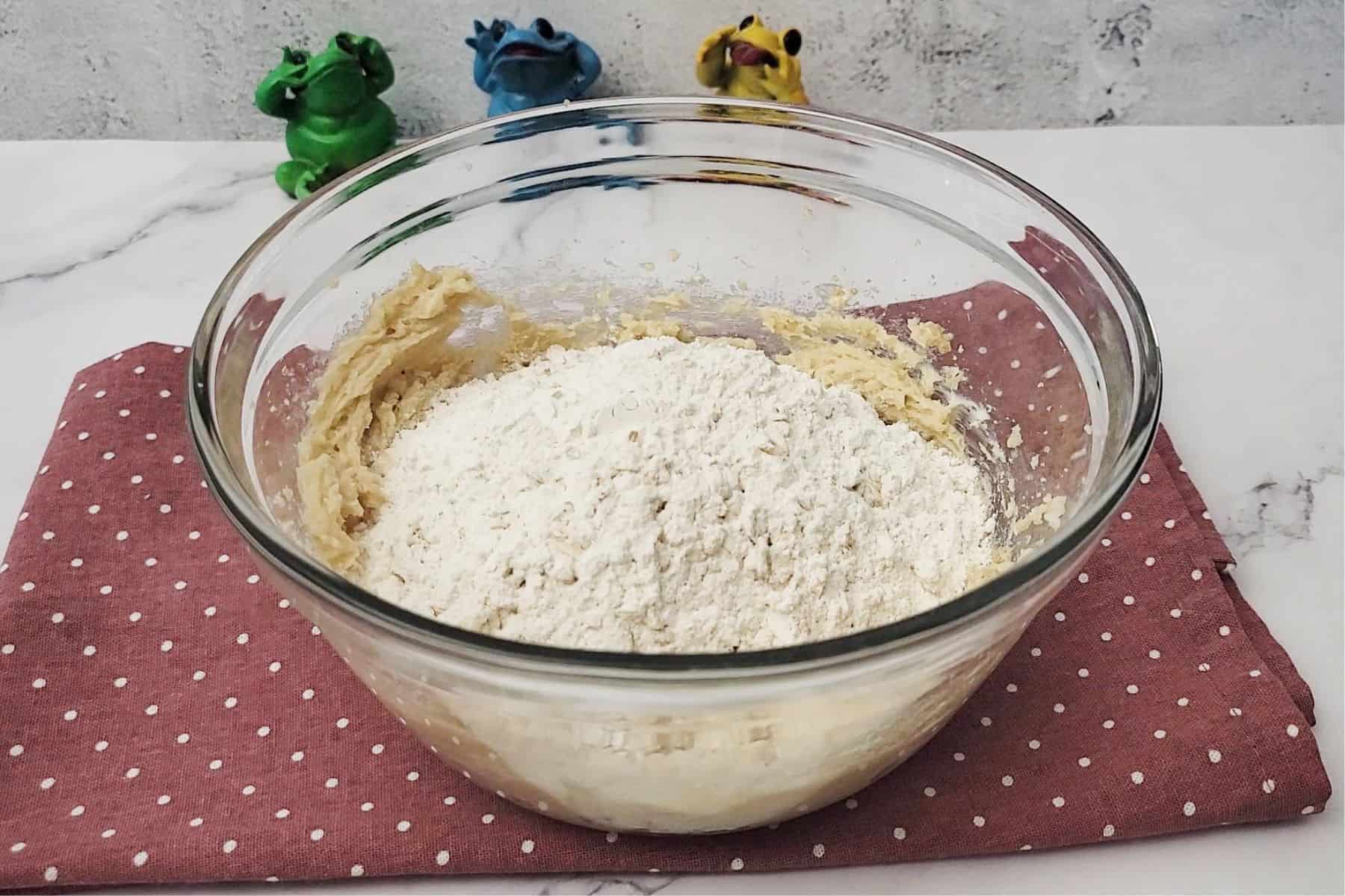 dry ingredients added to cookie dough bowl