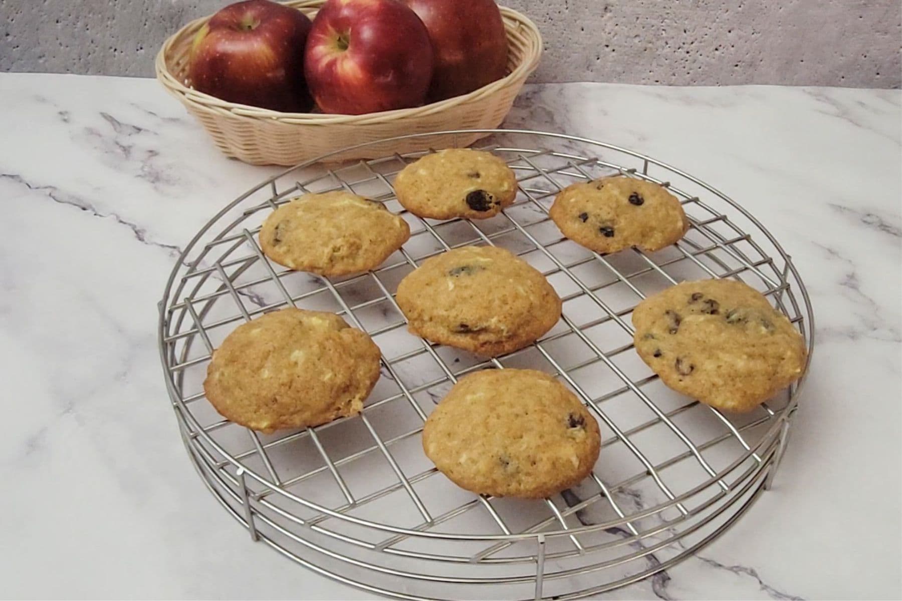 eggless apple cookies cooking on a wire rack