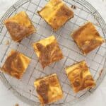overhead view of carrot cheesecake bars on a wire rack
