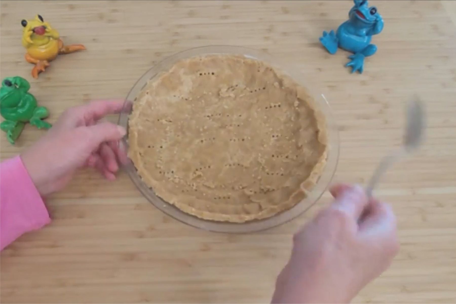 finished press-in peanut butter crust in a glass pie pan