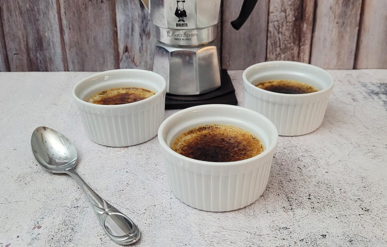 three crème brulee ramekins made with flavored with coffee