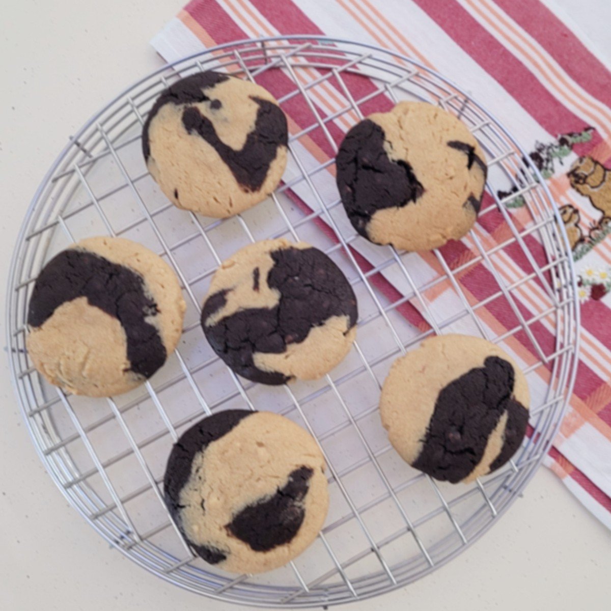 overhead view of peanut butter chocolate cookies on a cooling rack
