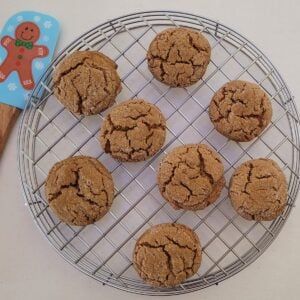 overhead view of crispy gluten free ginger cookies on a cooling rack