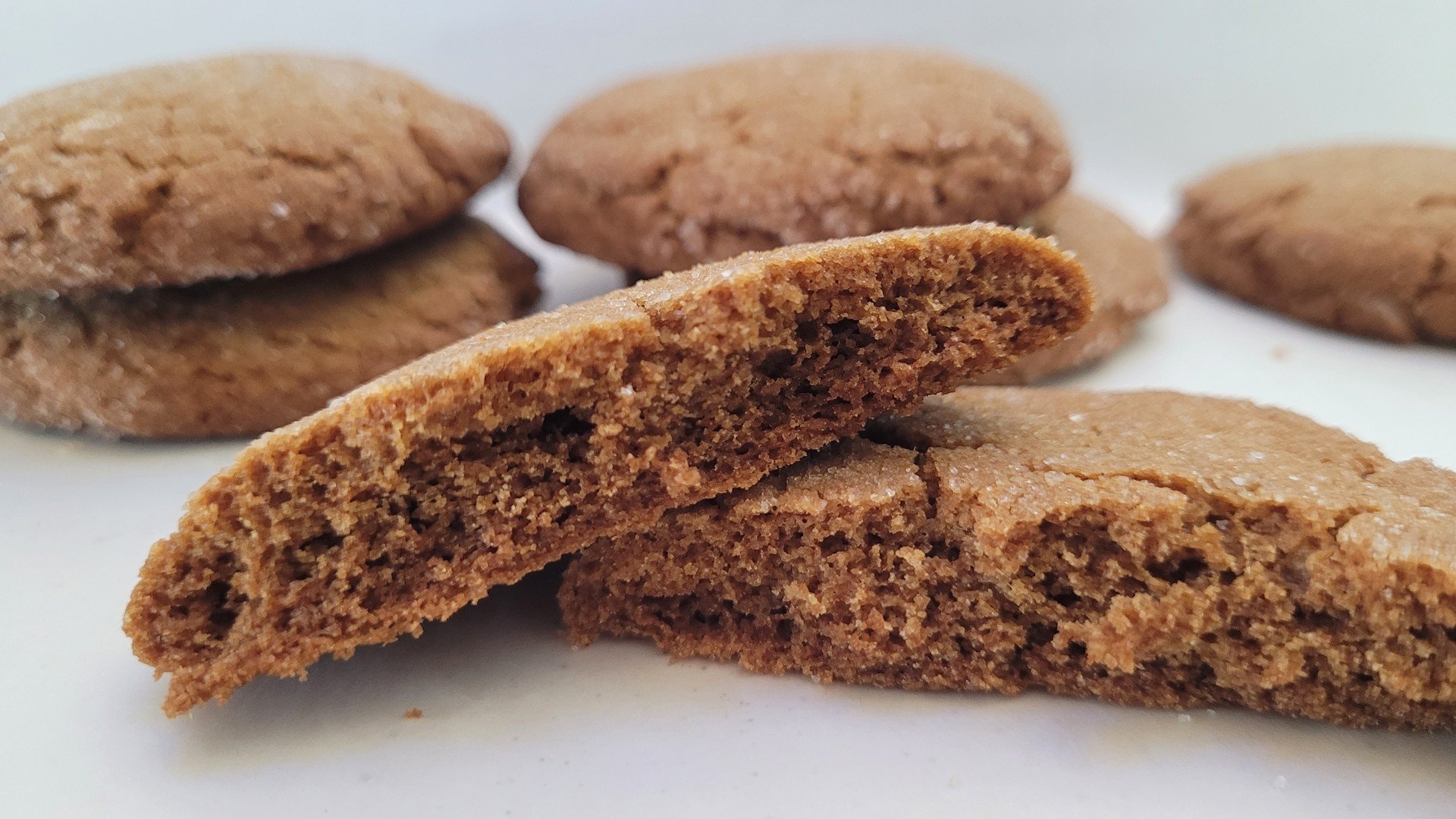 showing inside of crispy gluten free ginger cookie