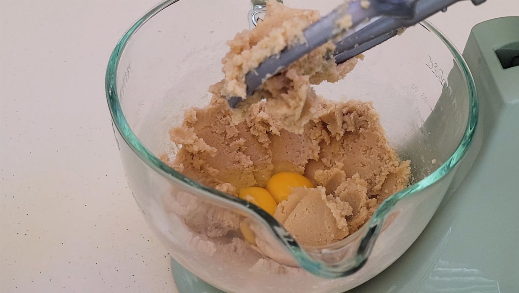 eggs and vanilla added to mixing bowl with creamed butter and sugars