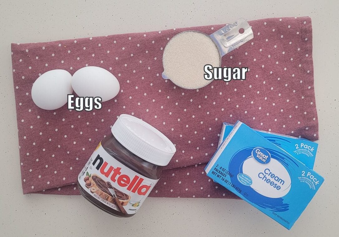 ingredients needed to make nutella swirl cheesecake bars filling including Nutella, cream cheese, sugar and eggs