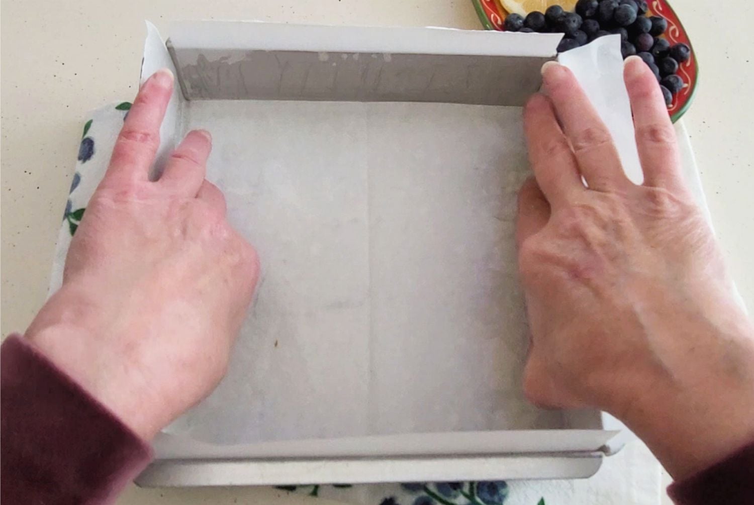 lining square baking pan with parchment paper