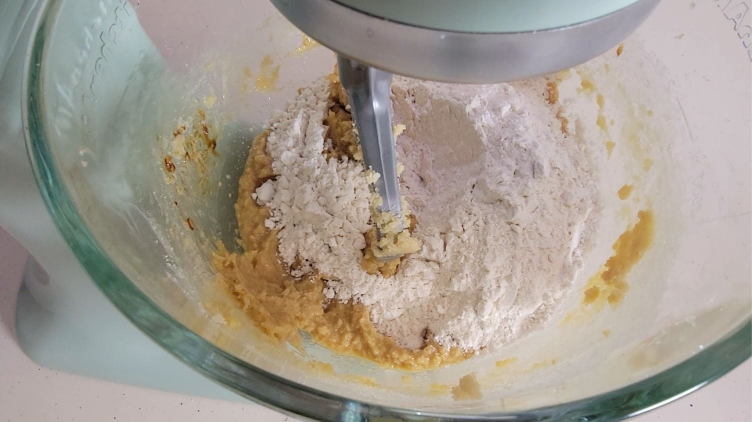 dry ingredients added to mixing bowl to make cookie dough