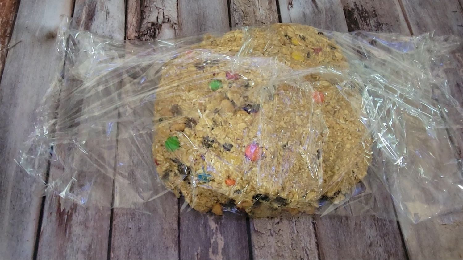 dough for GORP cookies wrapped in plastic to prepare for chilling before baking