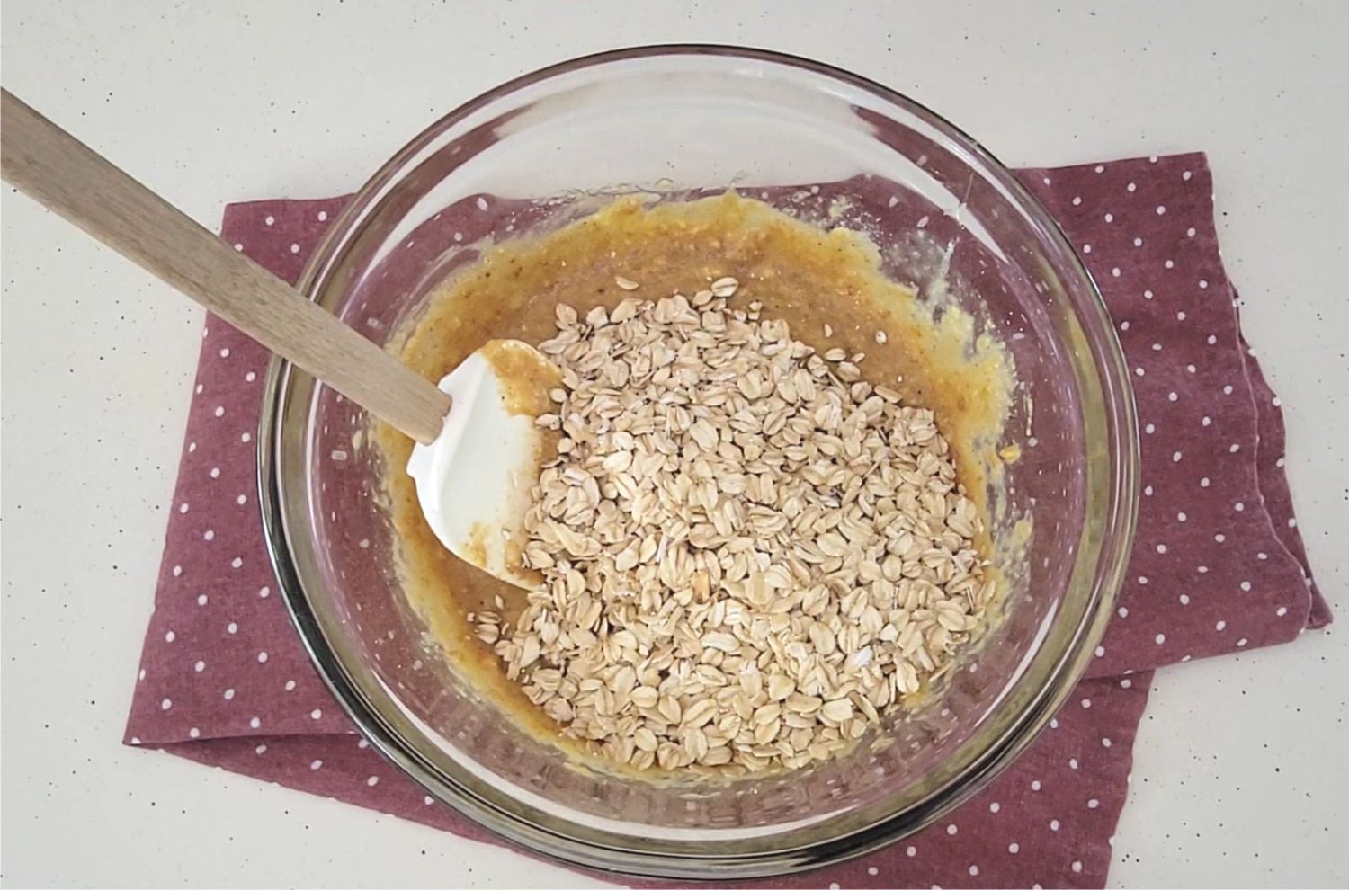 oatmeal added to glass mixing bowl